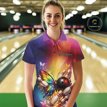 Load image into Gallery viewer, Female model at a bowling lane wearing a bowling polo shirt with a rainbow butterfly, bowling ball, and scattered pin artwork.