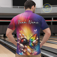 Load image into Gallery viewer, Front view of a male model in a bowling center wearing a quarter-zip shirt showcasing a rainbow butterfly and bowling-themed graphics.