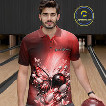 Load image into Gallery viewer, Male model at a bowling lane wearing a red bowling polo shirt with butterfly artwork, a bowling ball, and scattered pin graphics.