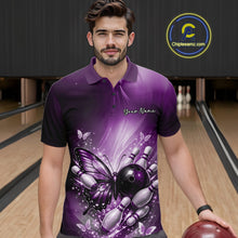 Load image into Gallery viewer, Male model wearing a purple bowling polo shirt at a bowling lane with butterfly artwork, a bowling ball, and scattered pin graphics.