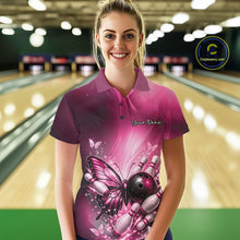 Load image into Gallery viewer, Female model at a bowling lane wearing a pink bowling polo shirt with butterfly artwork, a bowling ball, and scattered pin accents.
