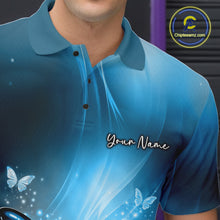 Load image into Gallery viewer, Close-up left chest detail of a blue bowling polo shirt with a butterfly beside a bowling ball and scattered pin artwork.
