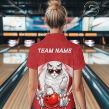 Load image into Gallery viewer, Back view of a female model in a bowling center wearing a white and red polo shirt showcasing a ragdoll cat beside a bowling ball.