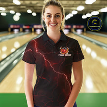 Load image into Gallery viewer, Female model wearing a black and red bowling polo in a bowling lane with dragon claw graphics and a flaming bowling ball design.