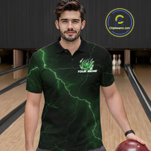 Load image into Gallery viewer, Male model at the bowling lane wearing a black and green bowling polo with fantasy dragon claw artwork and fiery bowling graphics.