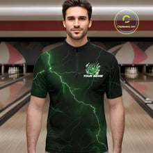 Load image into Gallery viewer, Male model at the bowling lane wearing a black and green quarter-zip with dragon claw graphics and flaming bowling ball details.