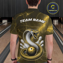 Load image into Gallery viewer, Back view of a mens bowling polo showcasing a yellow cobra wrapped around a bowling ball with scattered pins.