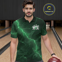 Load image into Gallery viewer, Male model wearing a bowling polo in a bowling lane with green cobra artwork wrapped around a bowling ball and scattered pins.