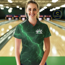 Load image into Gallery viewer, Female model wearing a bowling polo in a bowling lane with green cobra artwork, bowling ball graphics, and scattered pins.