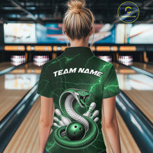 Load image into Gallery viewer, Back view of a womens bowling polo showcasing a green cobra wrapped around a bowling ball with lightning-inspired accents.