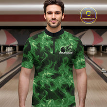 Load image into Gallery viewer, Male model wearing a green bowling quarter-zip in a bowling center with flaming bowling ball graphics.