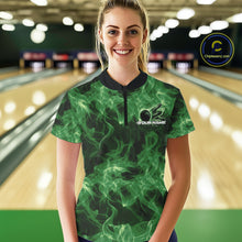 Load image into Gallery viewer, Female model wearing a green bowling quarter-zip in a bowling lane with flaming bowling ball artwork.