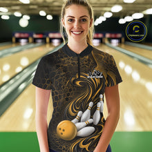Load image into Gallery viewer, Female model wearing a black and yellow bowling quarter-zip shirt in a bowling alley featuring a tribal flame bowling ball and pins graphic