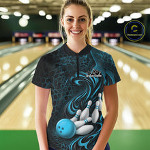 Load image into Gallery viewer, Female model standing in a bowling lane wearing a black and blue bowling quarter-zip shirt featuring a tribal flame bowling ball and pins graphic on the front.
