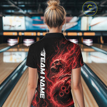 Load image into Gallery viewer, Back view of a female bowler in a bowling alley wearing a black bowling quarter-zip shirt with a red flaming skull holding a bowling ball amid swirling energy effects