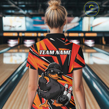 Load image into Gallery viewer, Back view of a womens black and orange bowling polo showcasing a duck, bowling pins, and geometric artwork.