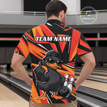 Load image into Gallery viewer, Front view of a male model in a black and orange bowling quarter-zip showcasing duck, bowling pin, and bowling ball graphics.