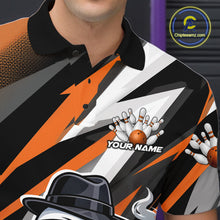 Load image into Gallery viewer, Detailed left chest view of a black and orange bowling polo showcasing duck and bowling-inspired artwork.