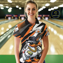 Load image into Gallery viewer, Female model wearing a black and orange bowling polo at the bowling lane with duck artwork in sunglasses and fedora holding cash and a cigar beside bowling pins.