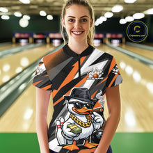 Load image into Gallery viewer, Female model in bowling lane wearing quarter-zip shirt featuring duck in sunglasses and fedora holding cash and cigar beside bowling ball and pins on black and orange design