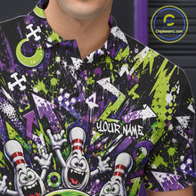 Load image into Gallery viewer, Close-up view of the left chest on a green and purple bowling polo shirt showcasing a mischievous green monster bowling ball with sharp teeth, a purple tongue, playful hand gesture, and cheerful cartoon bowling pins.