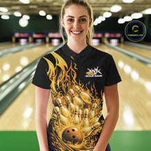 Load image into Gallery viewer, Front view of female model at bowling lane wearing black and yellow quarter zip shirt with flaming bowling ball striking pins and dynamic fire themed artwork.
