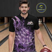 Load image into Gallery viewer, Male model wearing a black and purple bowling polo in a bowling alley with fiery bowling action artwork of a flaming ball striking pins.