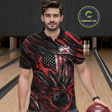 Load image into Gallery viewer, Male model at a bowling lane wearing a black and red bowling polo shirt with patriotic bowling strike artwork and fiery accents.
