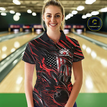 Load image into Gallery viewer, Female model at a bowling lane wearing a black and red bowling polo shirt with patriotic bowling action artwork and fiery pin graphics.