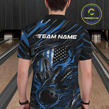 Load image into Gallery viewer, Back view of a male model in a bowling center wearing a black and blue polo shirt featuring a flaming bowling ball knocking down pins.