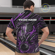 Load image into Gallery viewer, Front view of a male model in a bowling venue wearing a black and purple quarter-zip shirt featuring a bowling strike graphic with flame effects.
