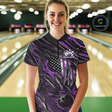 Load image into Gallery viewer, Female model in a bowling lane wearing a black and purple quarter zip shirt, front view featuring patriotic flames bowling ball striking pins with American flag inspired graphics