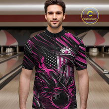 Load image into Gallery viewer, Male model wearing a black and pink bowling quarter-zip shirt at a bowling lane with fiery bowling strike artwork and patriotic graphics.