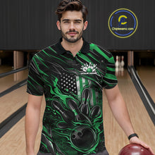 Load image into Gallery viewer, Male model at a bowling lane wearing a black and green bowling polo shirt with patriotic bowling strike artwork and flag-inspired graphics.