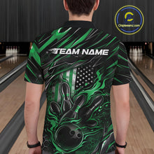 Load image into Gallery viewer, Back view of a male model in a bowling center wearing a black and green polo shirt featuring a flaming bowling ball and patriotic pin design.