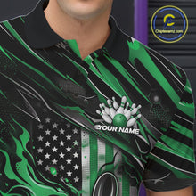 Load image into Gallery viewer, Close-up left chest view of a black and green bowling polo shirt featuring a patriotic flaming bowling ball striking pins with American flag details.