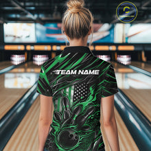 Load image into Gallery viewer, Female model inside a bowling venue, back view of black and green quarter zip shirt showcasing patriotic flames bowling ball striking pins with flag-inspired accents