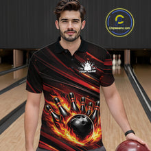Load image into Gallery viewer, Male model at a bowling lane wearing a black and red-orange bowling polo shirt with flaming bowling strike graphics and energetic accents.