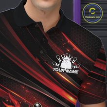 Load image into Gallery viewer, Close-up left chest detail of a black and red-orange bowling polo shirt featuring a flaming bowling ball knocking down pins.