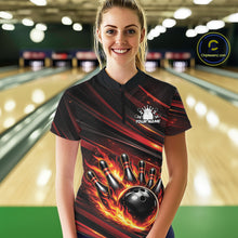 Load image into Gallery viewer, Female model in a bowling lane wearing black and red orange quarter zip shirt, front view showcasing fiery bowling ball hitting pins dynamic illustration