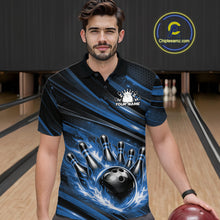 Load image into Gallery viewer, Male model at a bowling lane wearing a black and blue bowling polo shirt with fiery bowling action artwork and bold stripe accents.