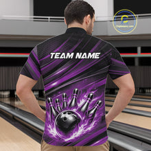 Load image into Gallery viewer, Front view of a male model in a bowling alley wearing a black and purple quarter-zip shirt featuring a bowling ball knocking down pins.