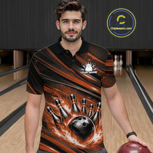 Load image into Gallery viewer, Male model at a bowling lane wearing a black and orange bowling polo shirt with flaming bowling strike artwork and energetic stripe details.