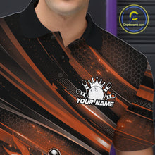 Load image into Gallery viewer, Close-up of the left chest on a black and orange bowling polo shirt featuring a fiery bowling ball striking pins with abstract accents.
