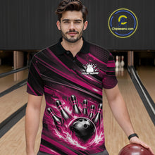 Load image into Gallery viewer, Male model wearing a black and pink bowling polo shirt at a bowling lane with fiery bowling action graphics and dynamic stripe accents.