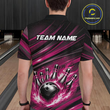 Load image into Gallery viewer, Back view of a male model in a bowling venue wearing a black and pink polo shirt featuring a flaming bowling ball hitting the pins.
