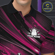 Load image into Gallery viewer, Close-up left chest detail of a black and pink bowling polo shirt featuring a fiery bowling ball and pin artwork with abstract stripes.
