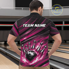 Load image into Gallery viewer, Front view of a male model in a bowling venue wearing a black and pink quarter-zip shirt featuring a flaming bowling ball hitting the pins.