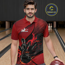 Load image into Gallery viewer, Male model at a bowling lane wearing a black and red bowling polo shirt with fiery bowling strike graphics and hexagonal accents.