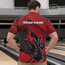 Load image into Gallery viewer, Front view of a male model in a bowling alley wearing a black and red quarter-zip shirt featuring a flaming bowling strike design.